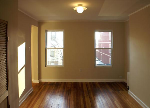 upstairs living area with restored wood floors